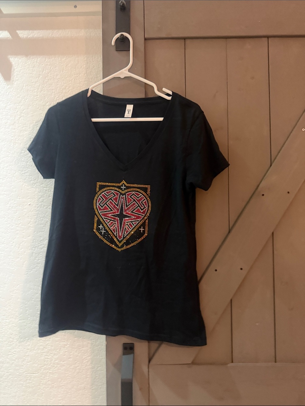 Embellished Black V-Neck Tee with Heart Shield Design